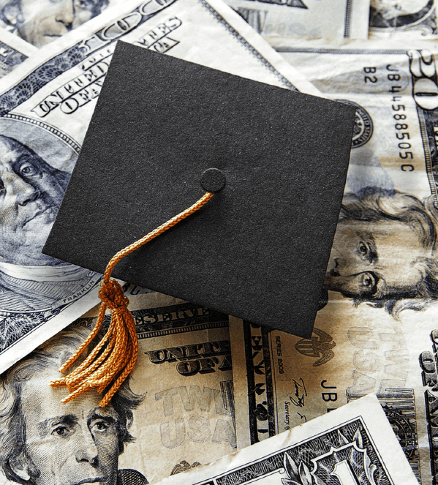 Student hat and money for loan payments