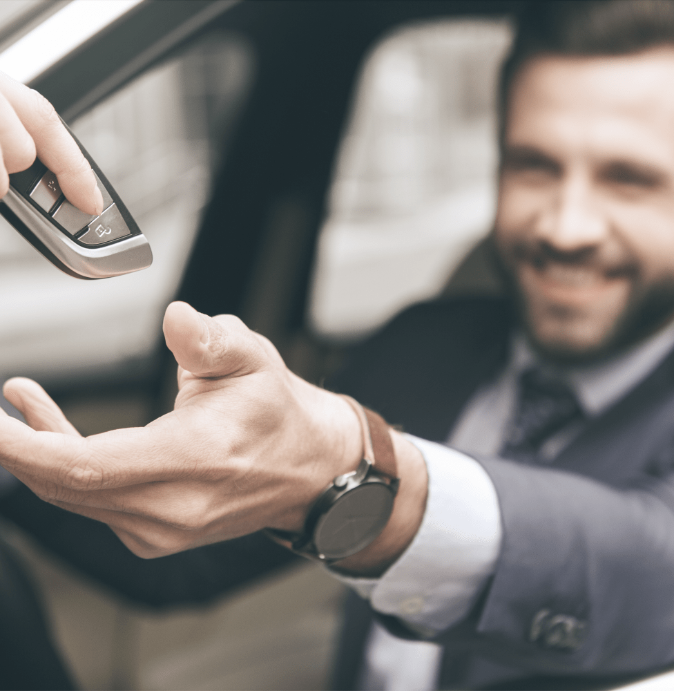 Driver getting keys after purchasing a car