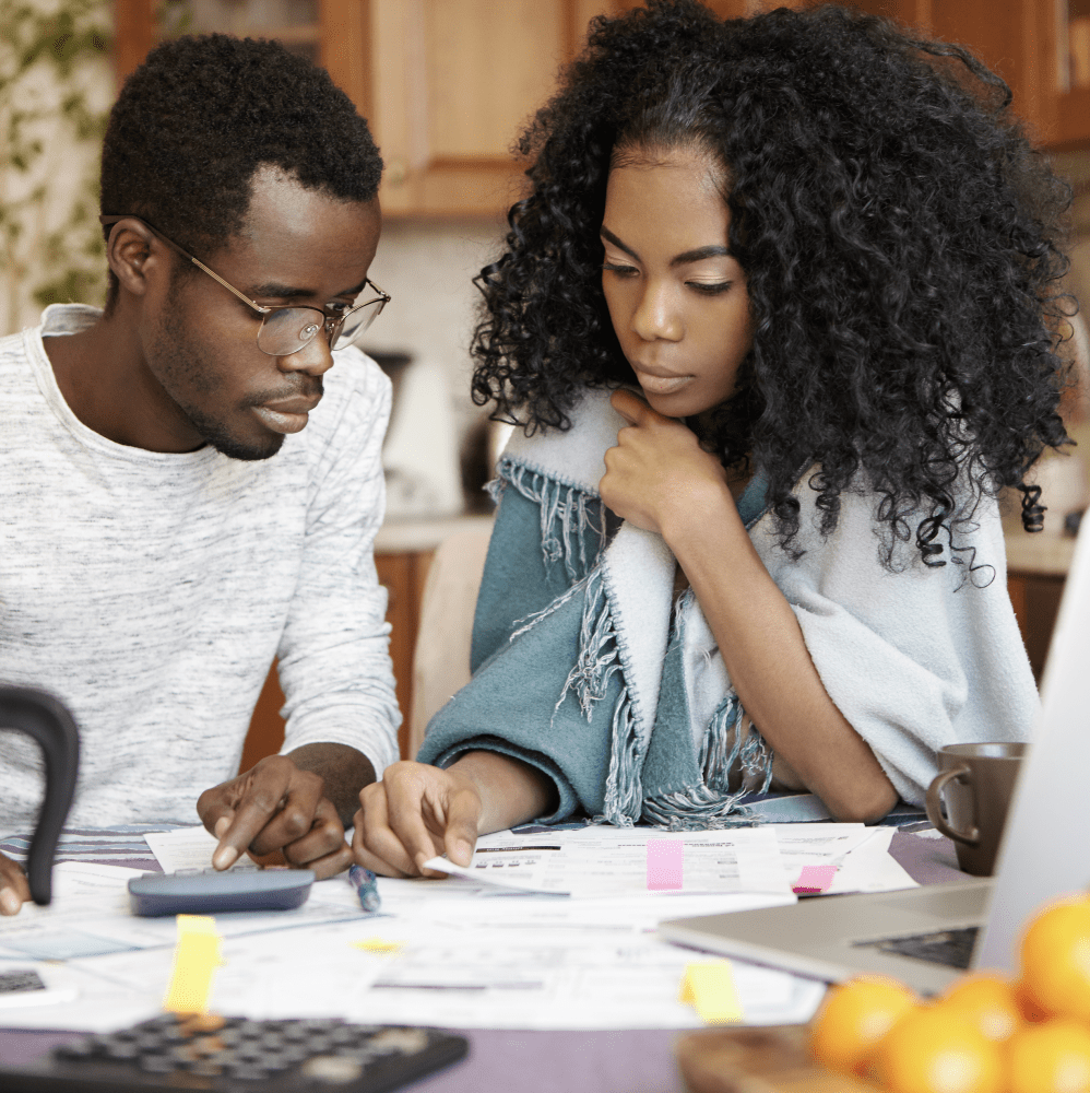 Couple reviewing chances to get a car loan refinance
