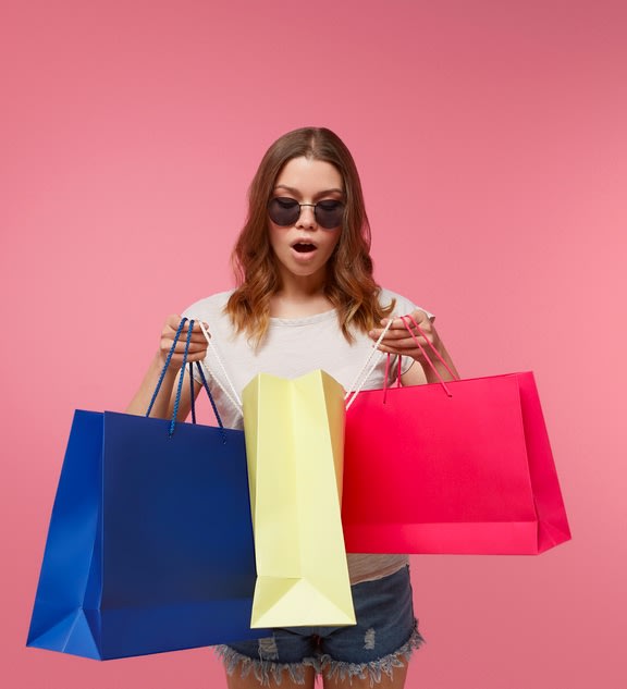 A woman doing shopping and being unable to resist impulse buying