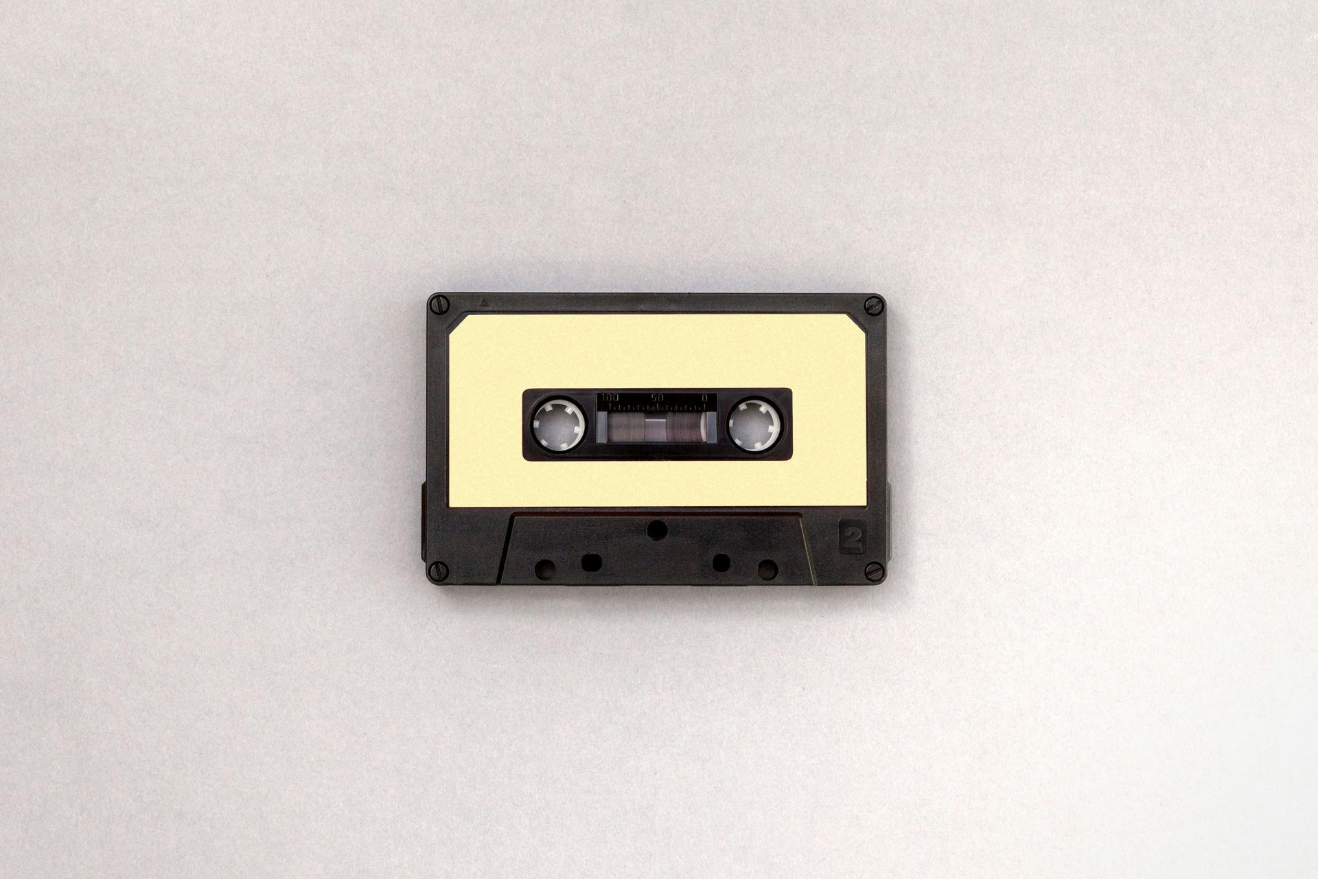 blank cassette on textured beige background
