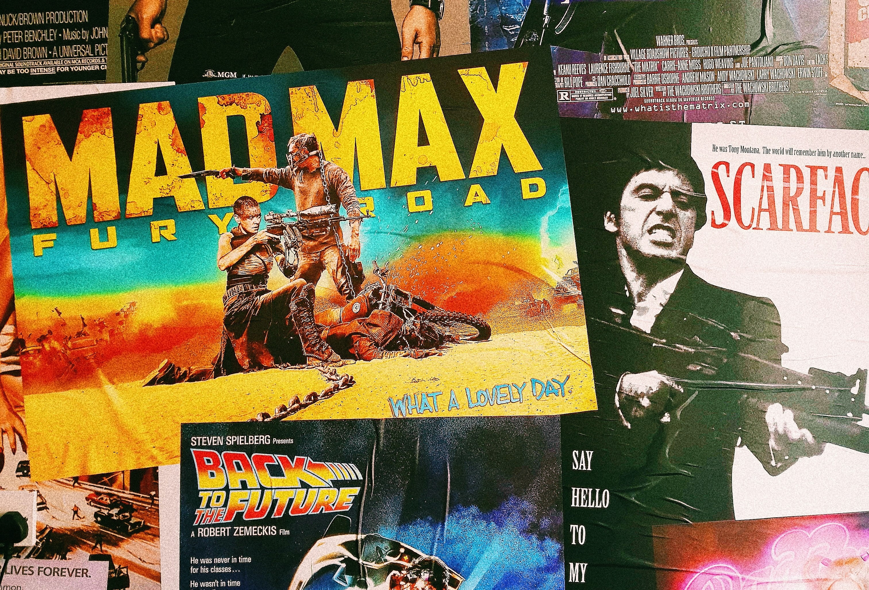 collage of movie posters with mad max fury road at front